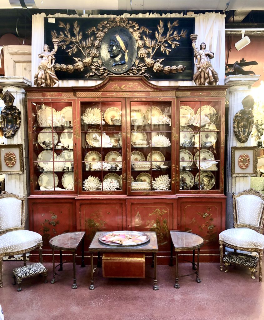 Red Lacquer Display Cabinet shown at The Antique and Design Center at High Point Market.